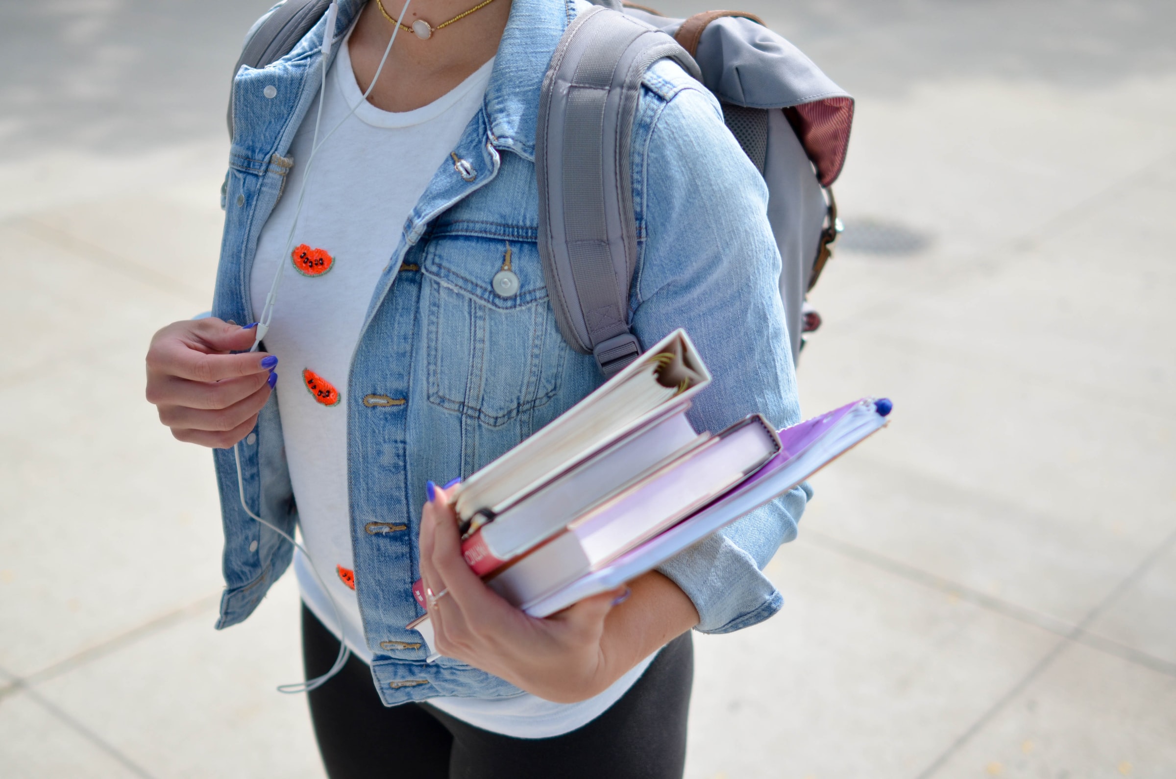 Student holding binders