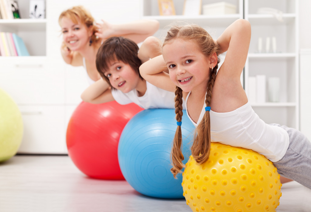 mom and her kids exercising