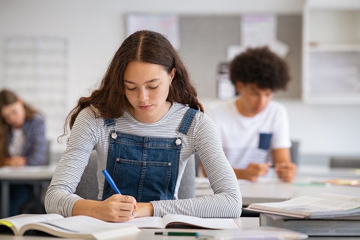 woman taking notes